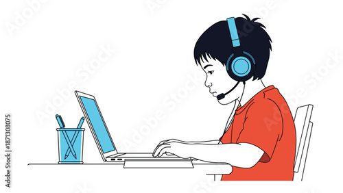 Young boy wearing a blue headset focuses on a laptop screen while participating in an online school lesson or distance learning class.