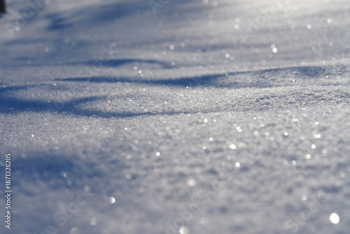 Obraz na plátně Panoramic view of fresh sparkling snow texture with soft drifts