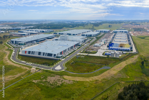 Drone aerial photograph of buildings in the large and growing industrial precinct of Kemps Creek in Western Sydney in New South Wales, Australia.
