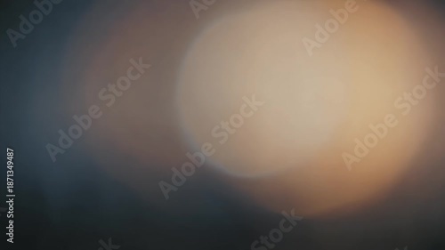Blurry Light Orbs Moving Across Dark Background.