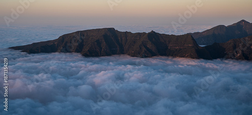 Rocky mountain ridge above clouds - view from Bica da Cana viewpoint in Madeira