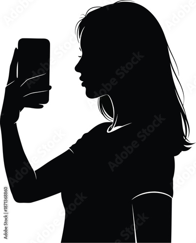 Silhouette profile of a young woman with long hair holding up a smartphone to take a picture or record a video against a bright white background