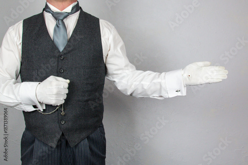 Fotografie Butler or Hotel Concierge With Welcoming Gesture