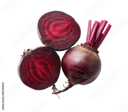 Three beetroots, sliced, vibrant crimson red, showing intricate vein patterns. Dark red stems and leaves
