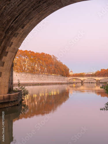 Tiber River Reflection Framed by Bridge at Sunset