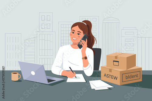 Smiling woman talking on smartphone writing notes in modern office workspace with laptop computer and cardboard boxes relocation concept for small business startup technology and communication profess