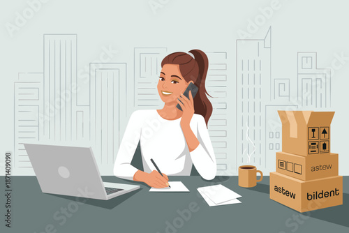 Smiling young woman talking on smartphone taking notes at desk with laptop and boxes in modern office business woman remote employee working communication for e-commerce shipping delivery service conc