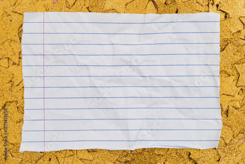 Lined paper note on gold star background