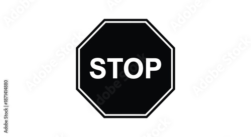 A classic black and white octagonal stop sign with bold white lettering is prominently displayed