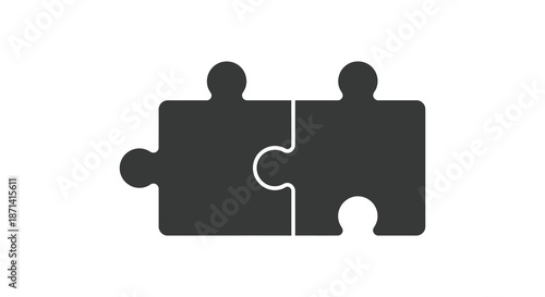 Two interlocking black puzzle pieces symbolize connection unity and problem solving solutions together