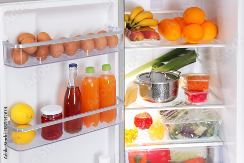 Wallpaper Mural Modern refrigerator with different fresh food products, closeup Torontodigital.ca