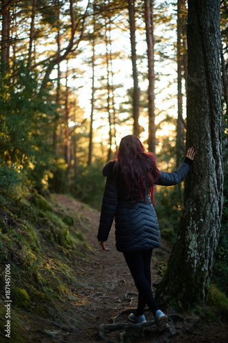 Wallpaper Mural Woman walking on a mountain trail at sunset during autumn on the Hermitages route in Tella Pyrenees Spain Torontodigital.ca