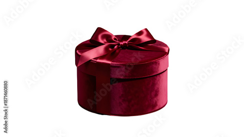 A luxurious red velvet gift box with a satin ribbon on a black background