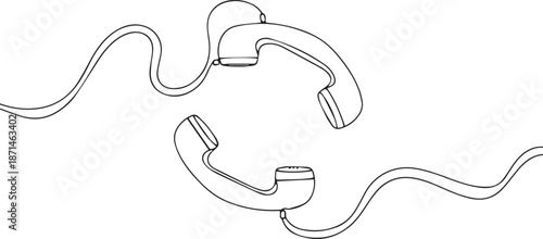 Two vintage rotary phones connected by tangled cords