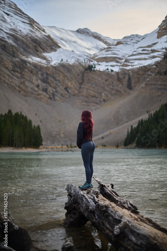 Wallpaper Mural Woman standing by the shore of Ibon de Plan glacial lake admiring the stunning mountain scenery in the Pyrenees of Spain Torontodigital.ca