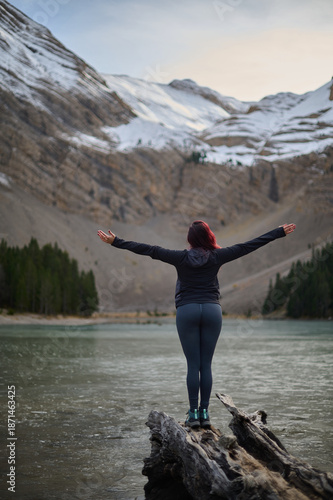 Wallpaper Mural Woman standing by the shore of Ibon de Plan glacial lake admiring the stunning mountain scenery in the Pyrenees of Spain Torontodigital.ca