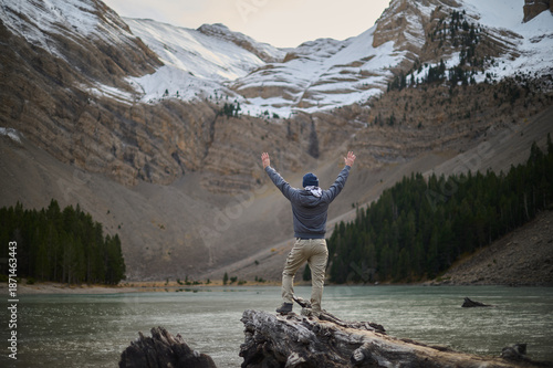 Wallpaper Mural Man enjoying the breathtaking views of Ibon de Plan glacial lake surrounded by high mountains in the Pyrenees of Aragon Spain Torontodigital.ca