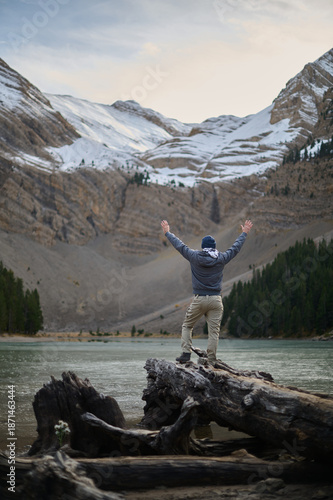Wallpaper Mural Man enjoying the breathtaking views of Ibon de Plan glacial lake surrounded by high mountains in the Pyrenees of Aragon Spain Torontodigital.ca