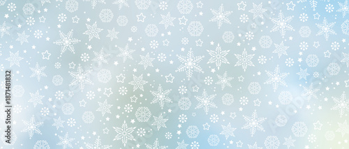 Winter background with white snowflakes on light blue gradient, banner format