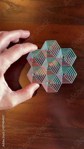 Antistress meditation fidget toy being rotated.  Hexagon circle movement calms the nerves and mind.