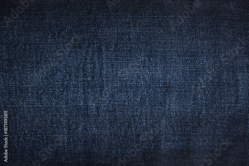 Denim jeans texture or denim jeans background. Dark blue jeans fabric.