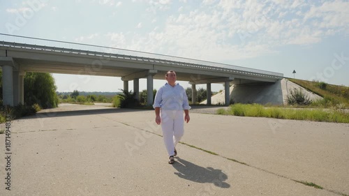 Determined overweight woman walking on an empty road