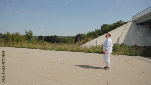 Plump woman walking alone on asphalt road