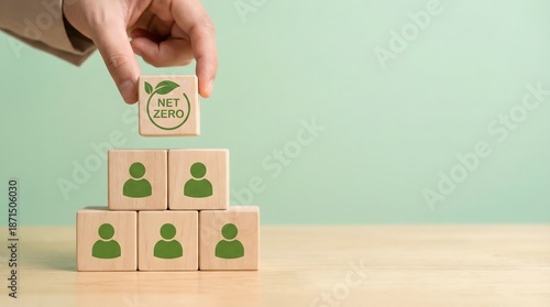 Wallpaper Mural Hand placing Net Zero cube on stack of people icons, environmental concept Torontodigital.ca