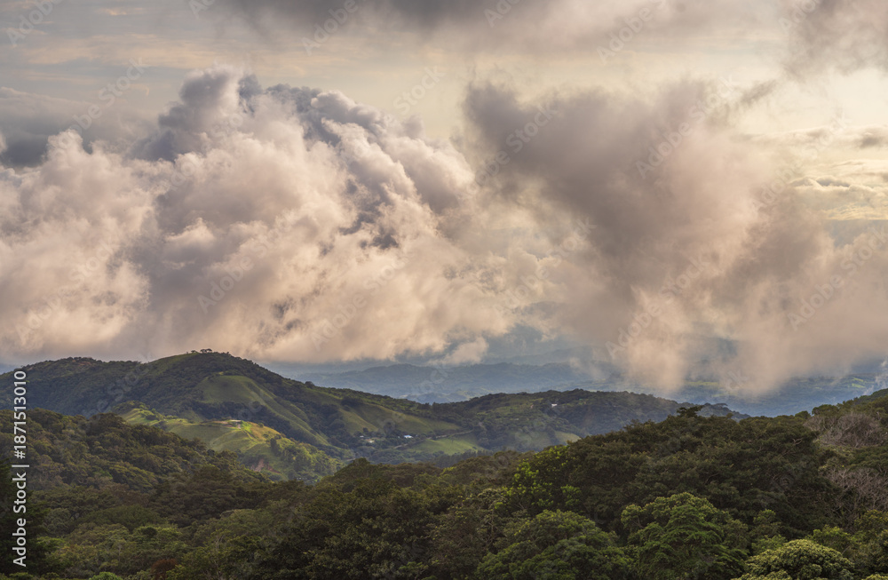 Naklejka premium Storm clouds over the landscape of Monteverde in Costa Rica looking west towards Pacific Ocean