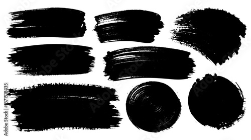 Collection of black paint brush strokes and circular marks with rough textured edges forming abstract design set