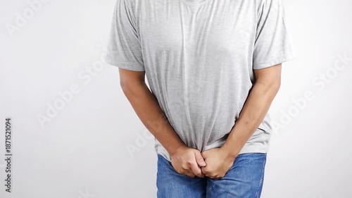 Urinary incontinence, man holding crotch, urgent need to urinate, health problems, cystitis.Erectile dysfunction concept. Men's health. Man holding genitals.Men's health, venereologist, sexual disease