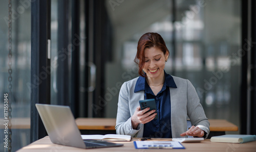 Fotografie Business woman or accountant working online at office, laughing, using a phone and internet