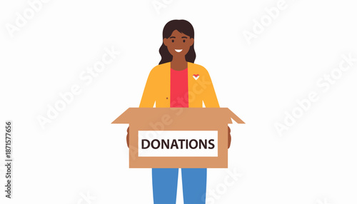 Woman holding a cardboard box labeled donations with a smile.