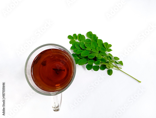 A cup of moringa herbal tea on a white background. Healthy lifestyle