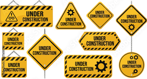 Set of yellow under construction signs with caution stripes and gear icons hanging on metal chains for website maintenance page.