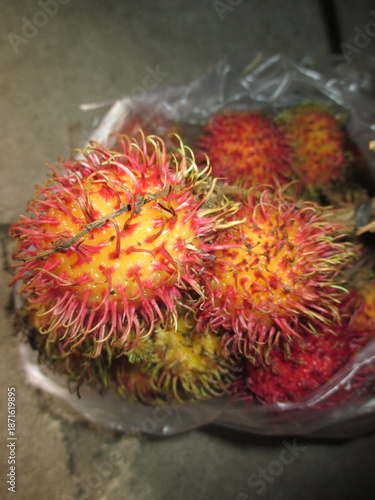 sweet and fresh rambutan fruit in a plastic container to enjoy