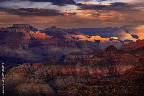 Majestic Grand Canyon Landscape at Sunset with Golden Light Illuminating Red Rock Layers