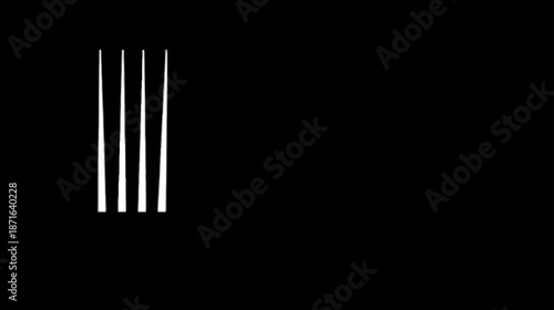 Close-up detail of shiny metal fork prongs on a dark black background, minimalist dining cutlery for kitchen and restaurant concepts.