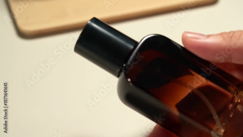 A person using various skincare products, serums, and lotions