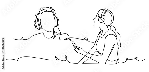 Woman sitting and listening to music on headphones in a relaxed pose