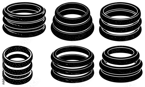 Stacked black rubber rings with white dotted texture on white background black rings white dots