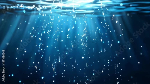Sunbeams piercing through deep blue water with numerous small bubbles creating an ethereal underwater scene.