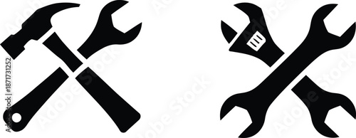 A simple arrangement of common hand tools including hammers and wrenches