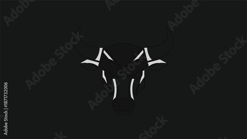 Minimalist bull silhouette against a dark background, artistic representation of strength.
