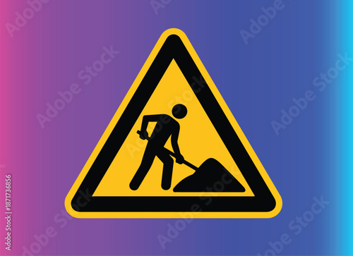 A yellow triangular warning sign. Within the triangle, there's a silhouette of a person, seemingly engaged in some construction or digging activity.