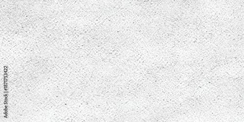 A closeup of a blank white paper and rough cement wall texture creates a light grey plaster surface with a dirty grunge pattern and old stucco material design