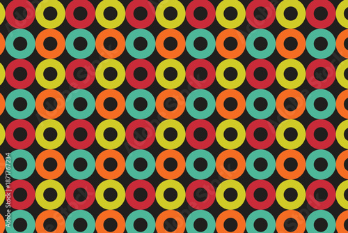 This image displays a vibrant, geometric pattern composed of rows of colorful rings set against a dark background. The rings, arranged in a grid formation, feature a repetitive sequence of four colors