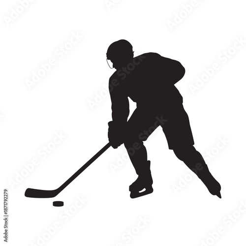 Silhouette of a hockey player in action with stick and puck
