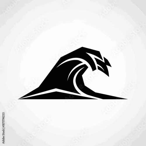 High quality professional stock photo of a young businesswoman using a laptop while sitting in a modern sunlit office workspace