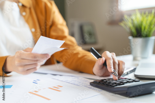 Valokuva person using calculator calculating tax refund on the table